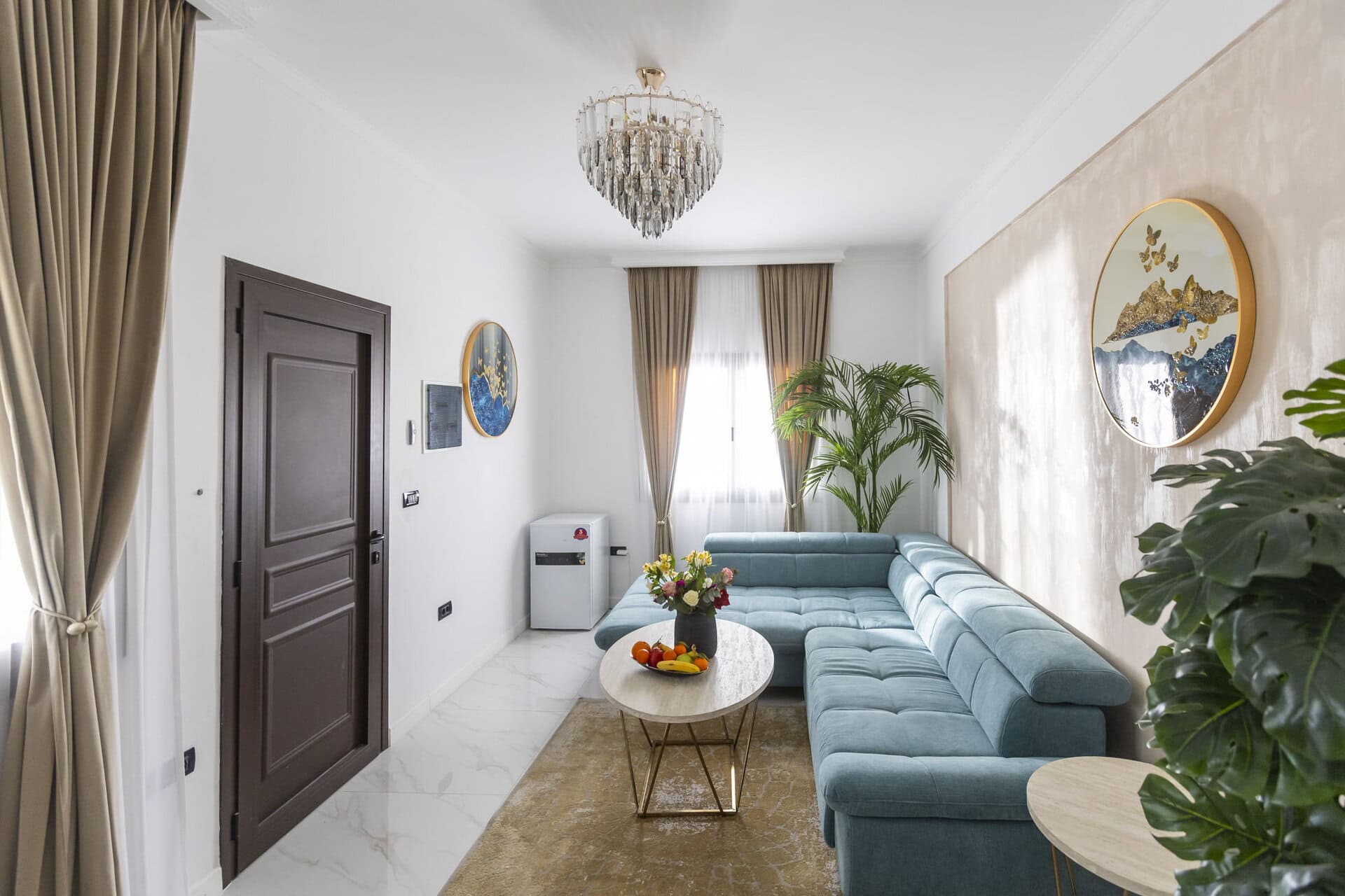 Living area with sofa and coffee table at Adonis Aegina Bungalows