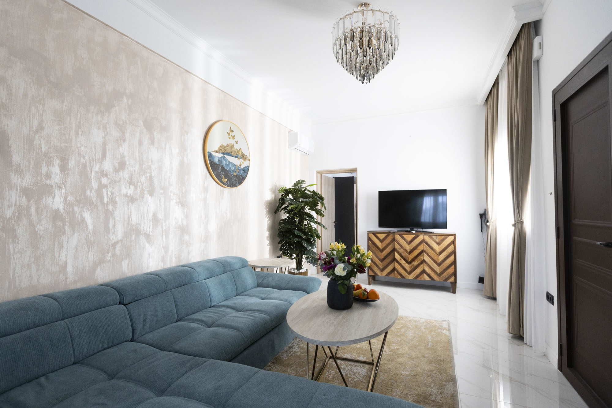 Living room with seating and television at Adonis Aegina Bungalows