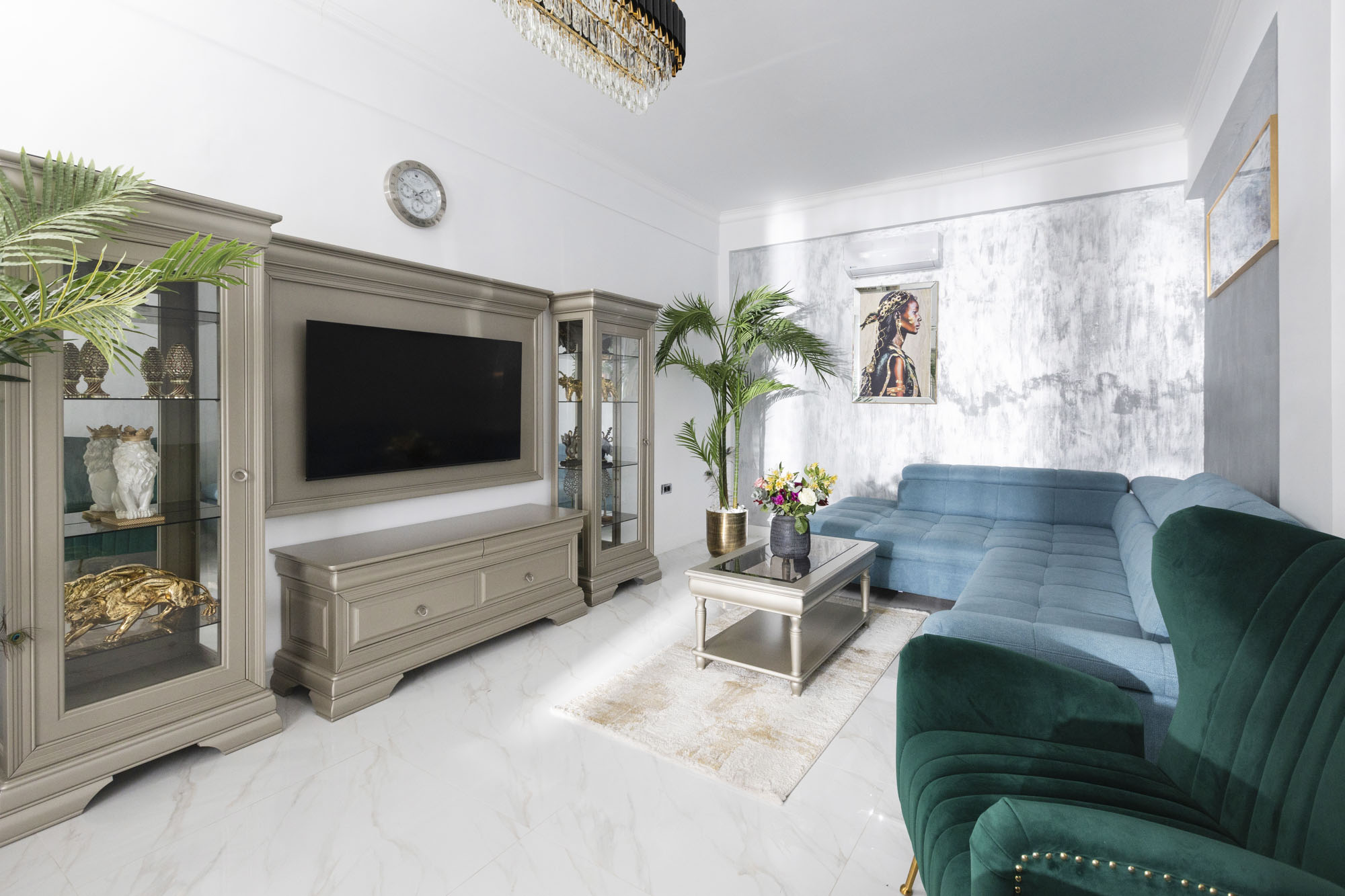 Living area with sofa and television in Bungalow Poseidon at Adonis Aegina Bungalows