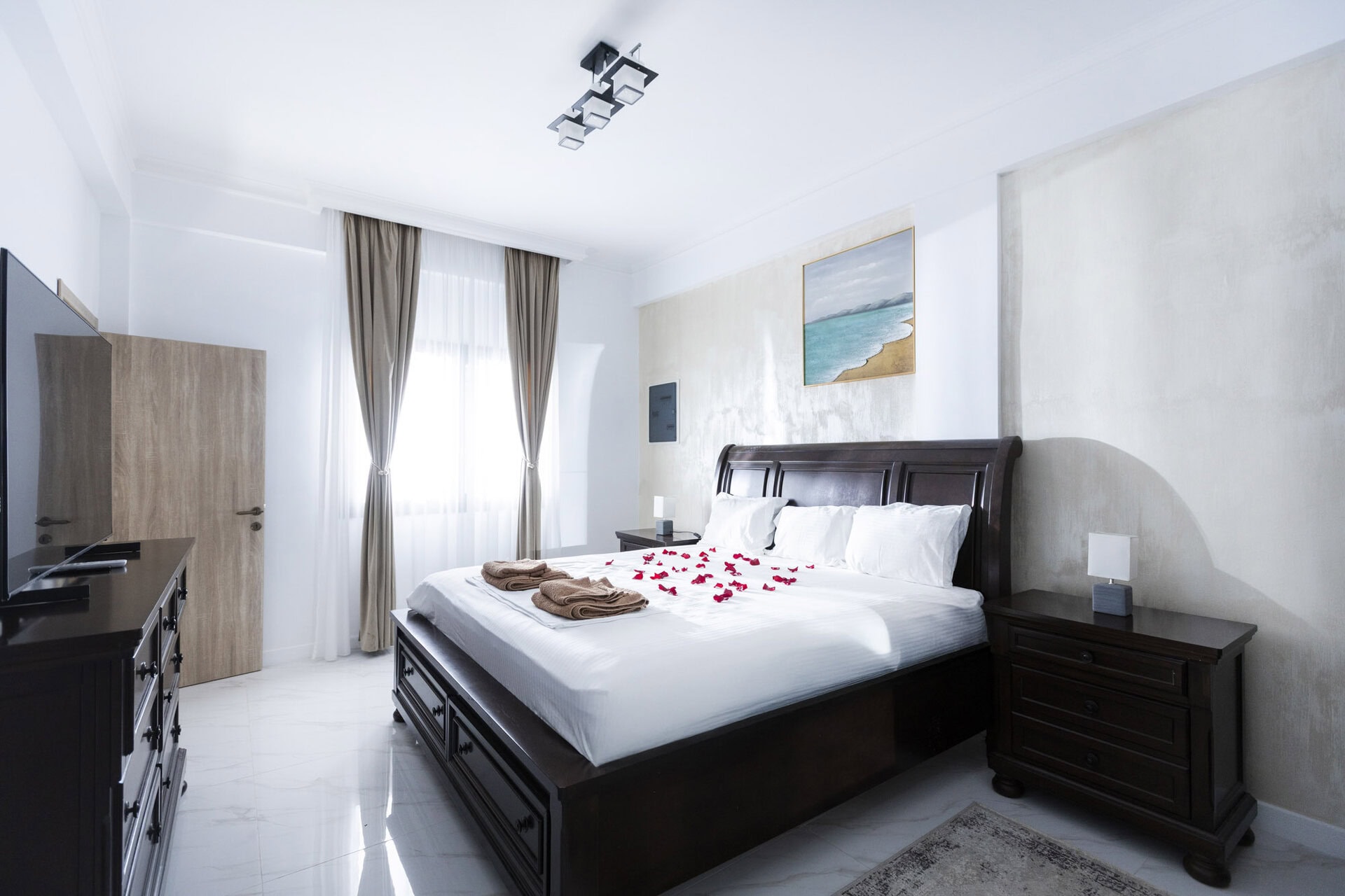Bedroom with double bed in Bungalow Poseidon at Adonis Aegina Bungalows