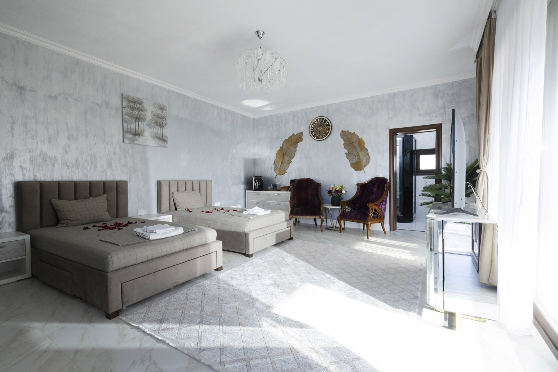 Bright bedroom with double bed and decor in Bungalow Hermes at Adonis Aegina Bungalows