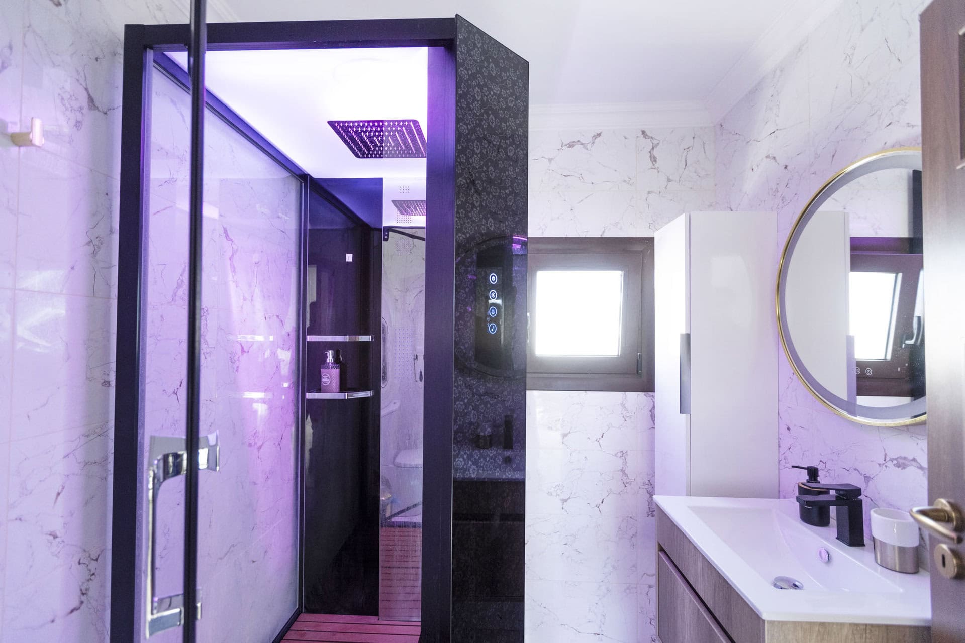 Modern bathroom with walk-in shower and ambient lighting in Bungalow Hermes at Adonis Aegina Bungalows