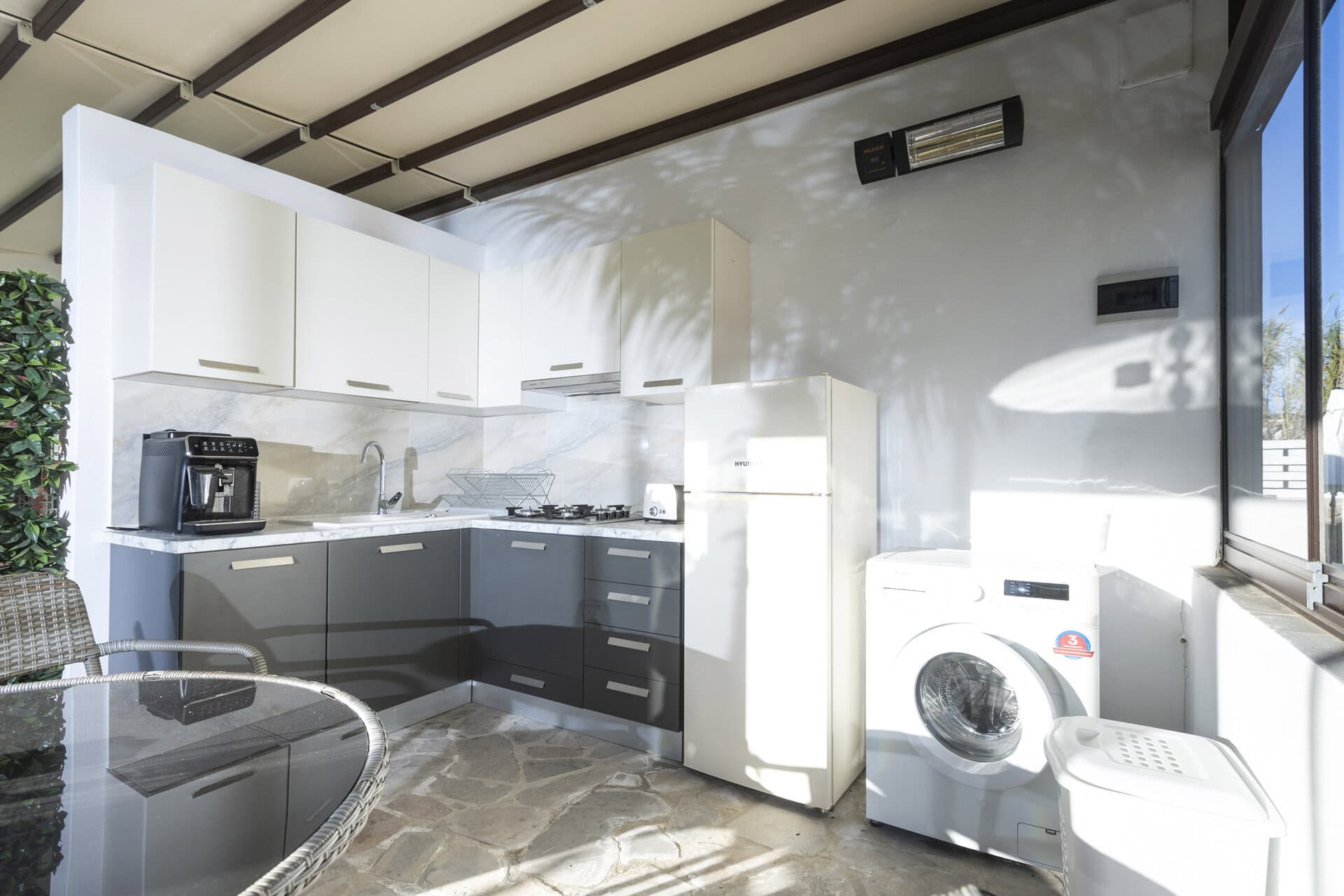 Outdoor kitchen and utility area of Bungalow Apollo at Adonis Aegina Bungalows