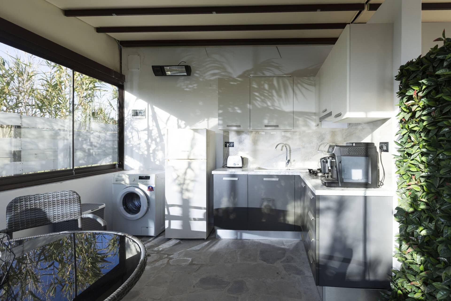 Outdoor kitchen and utility area at Adonis Aegina Bungalows