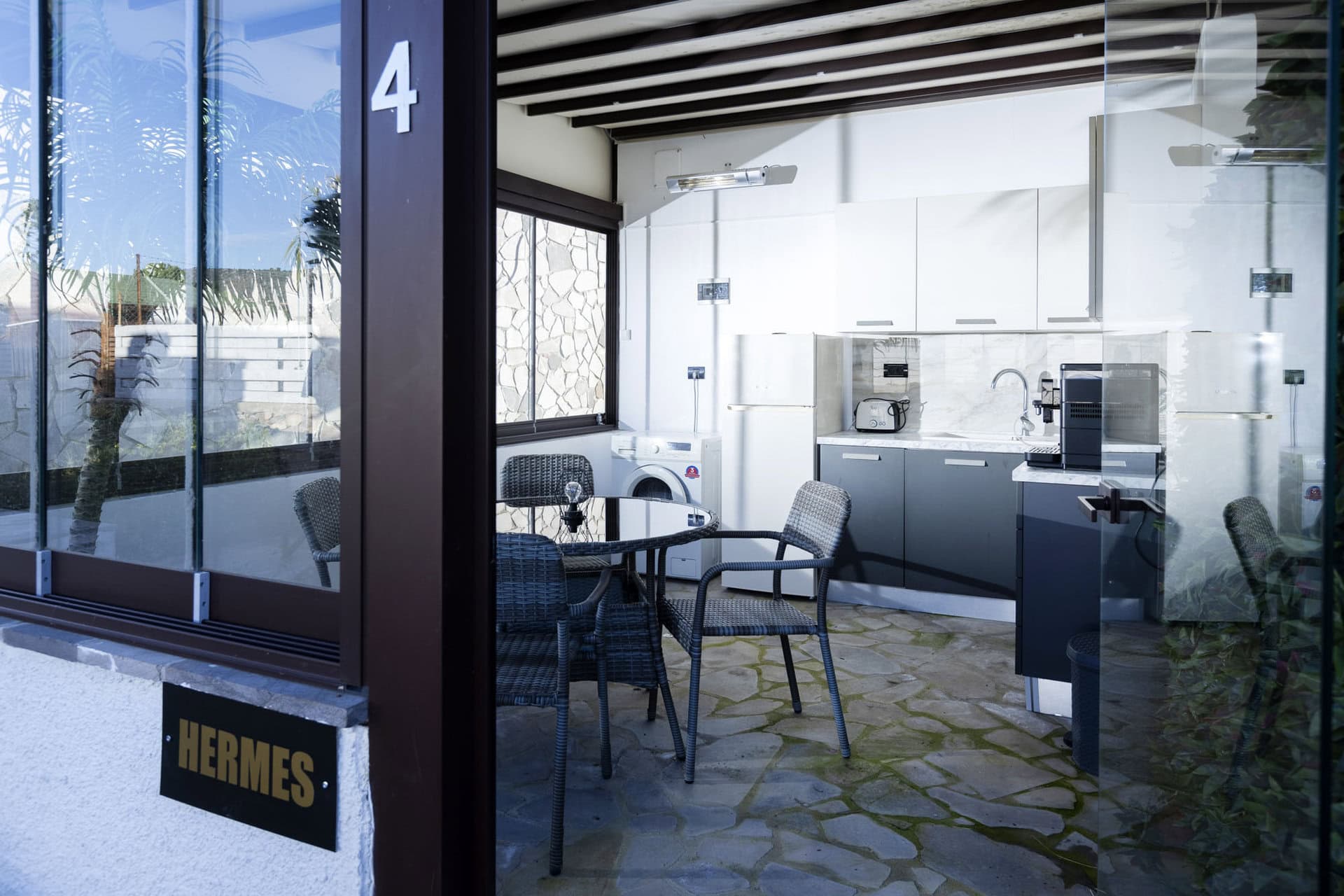 Outdoor kitchen and utility area of Bungalow Athena at Adonis Aegina Bungalows