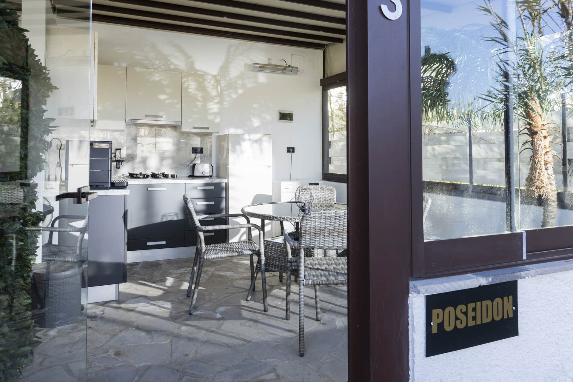 Outdoor kitchen and utility area of Bungalow Poseidon at Adonis Aegina Bungalows